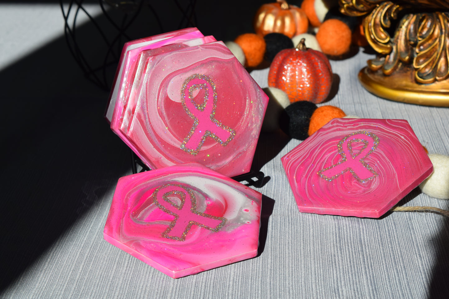 These coasters are uniquely hand painted with a glamourous sparkle and durable resin finish.