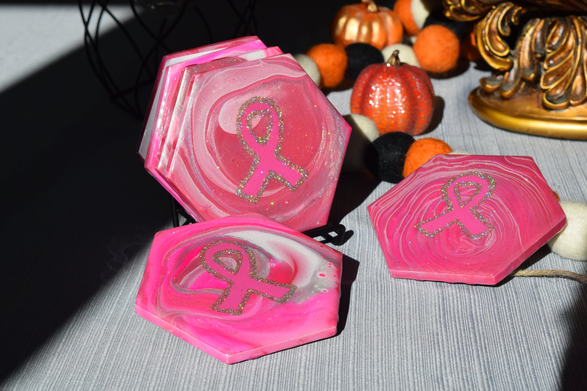 These coasters are uniquely hand painted with a glamourous sparkle and durable resin finish.